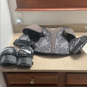 Nike black lacrosse pads with elbow pads